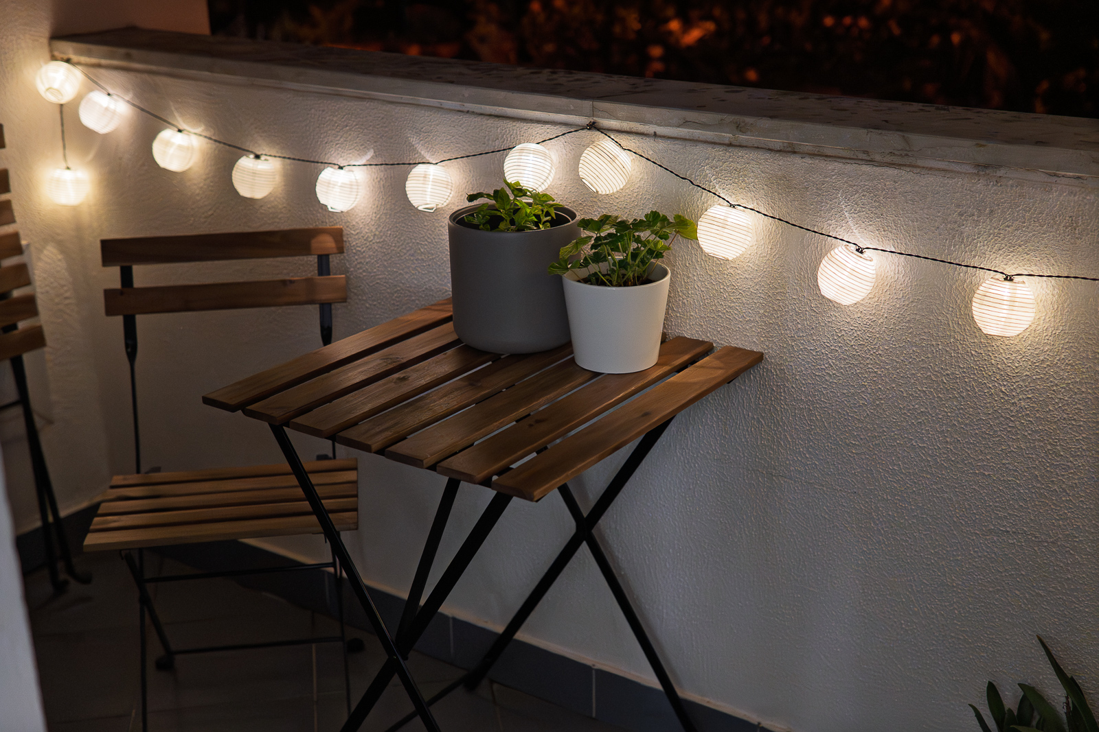Balcony at night with lights at Apartment Rainforest